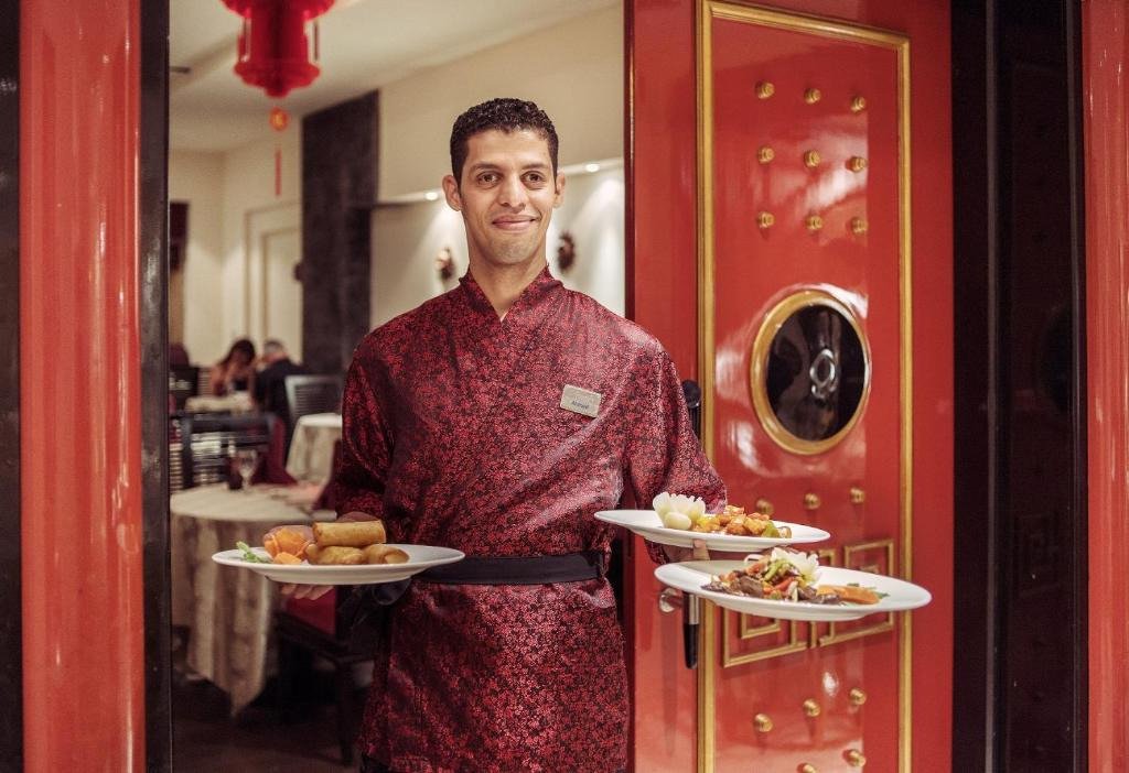 Waiter with food Premier La Reve